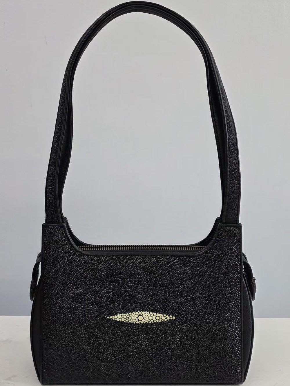 Minimalist Black Shoulder Bag with Subtle Light Accent